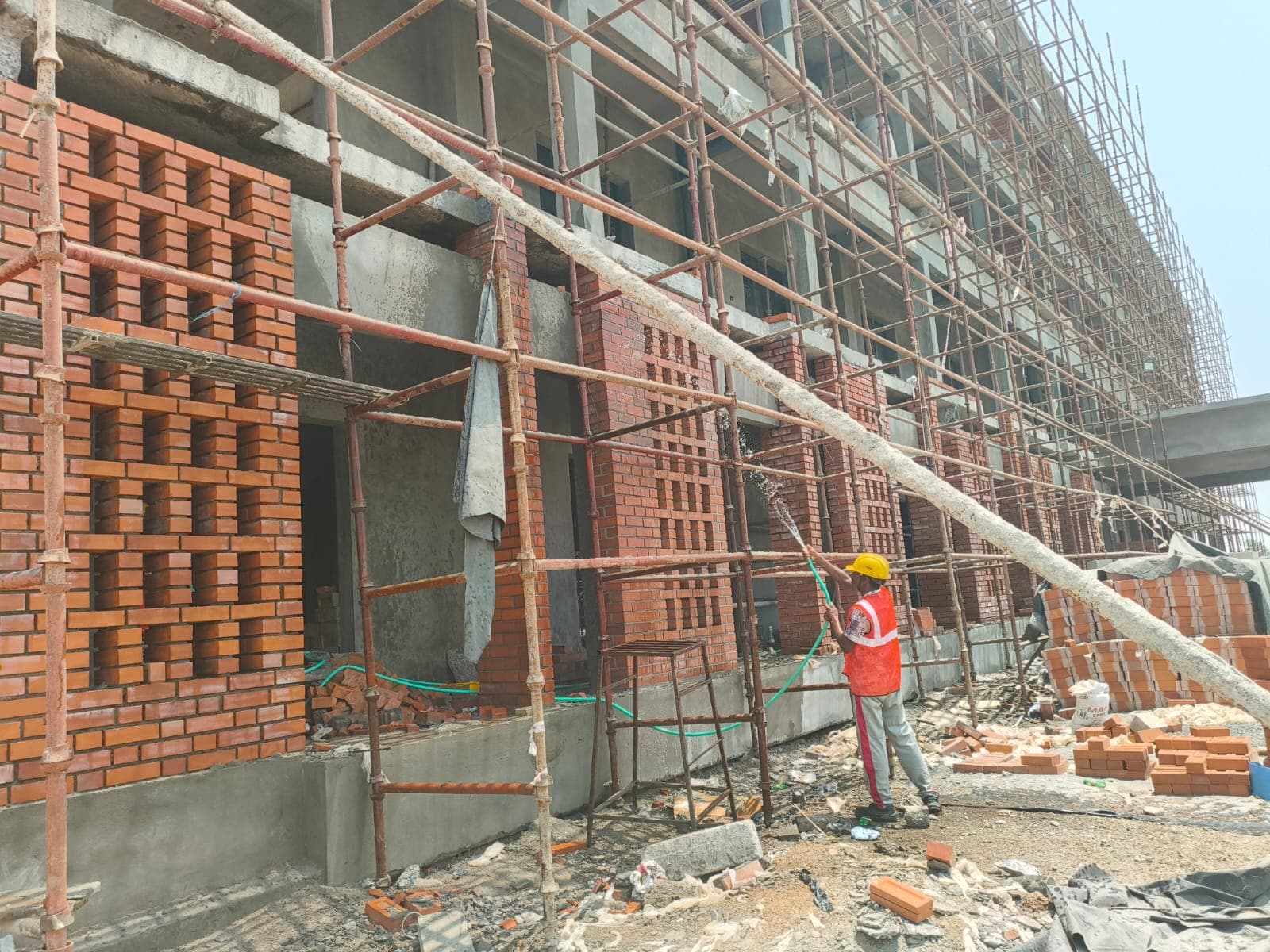 Wet Curing Across Multi-Bay Brickwork Facade